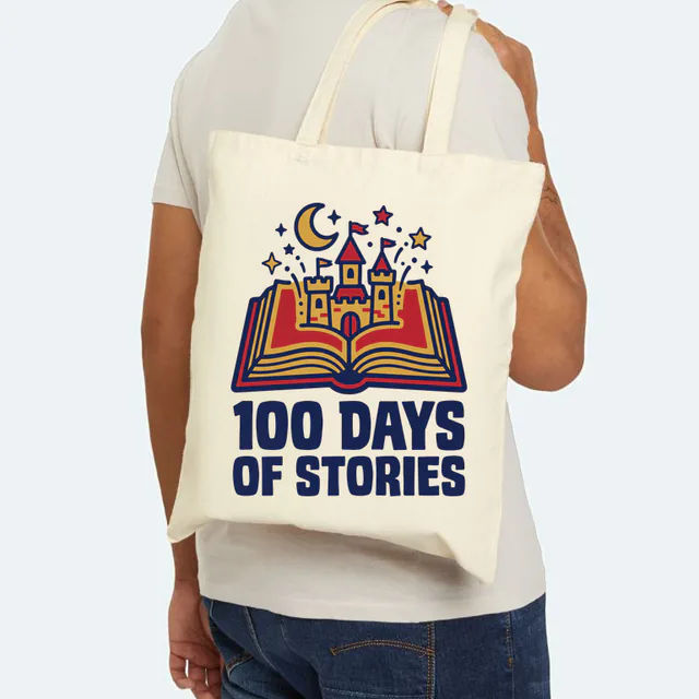 An open book with a castle rising out, 100 DAYS OF STORIES, on a natural canvas tote