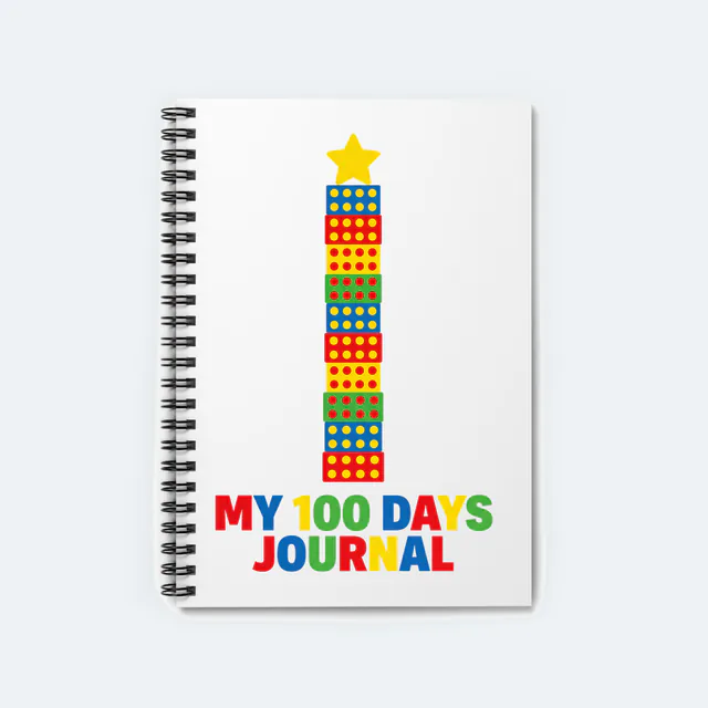 A tower of ten dotted blocks, MY 100 DAYS JOURNAL, on a white spiral notebook