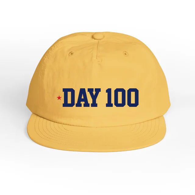A tiny red star beside DAY 100, on a sunset surf cap