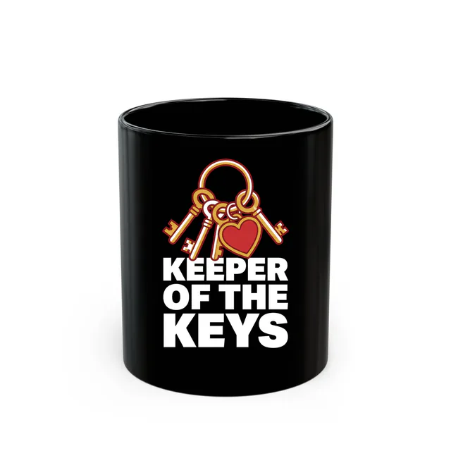 A ring of keys with a heart fob, KEEPER OF THE KEYS, on a black mug
