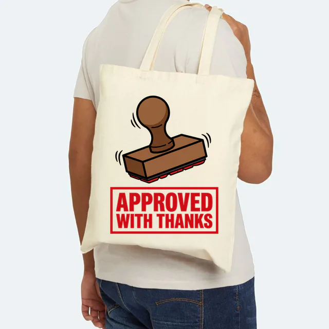 A rubber stamp over APPROVED WITH THANKS in red ink, on a natural canvas tote