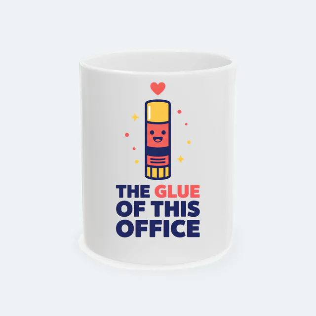A smiling glue stick, THE GLUE OF THIS OFFICE, on a white ceramic mug