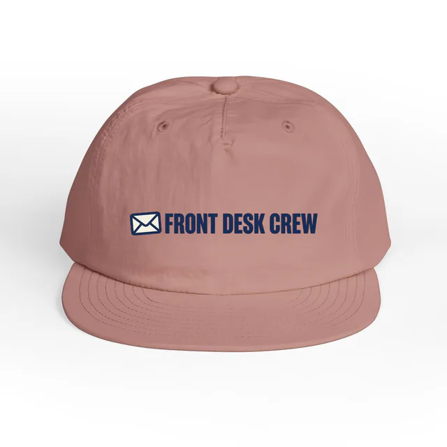 A small envelope beside FRONT DESK CREW, on a hazy pink surf cap