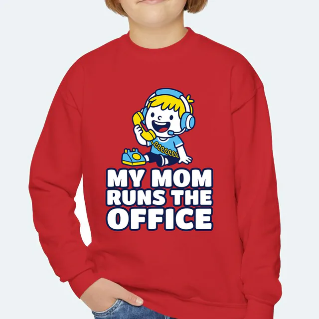A kid in a headset on a toy phone, MY MOM RUNS THE OFFICE, on a red youth crewneck