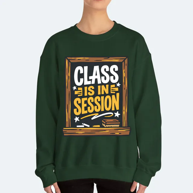 A chalkboard frame holding CLASS IS IN SESSION, on a forest green adult crewneck