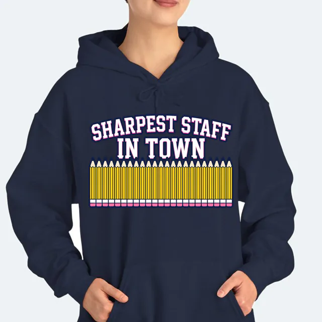 A picket fence of sharpened pencils, SHARPEST STAFF IN TOWN, on a navy adult hoodie