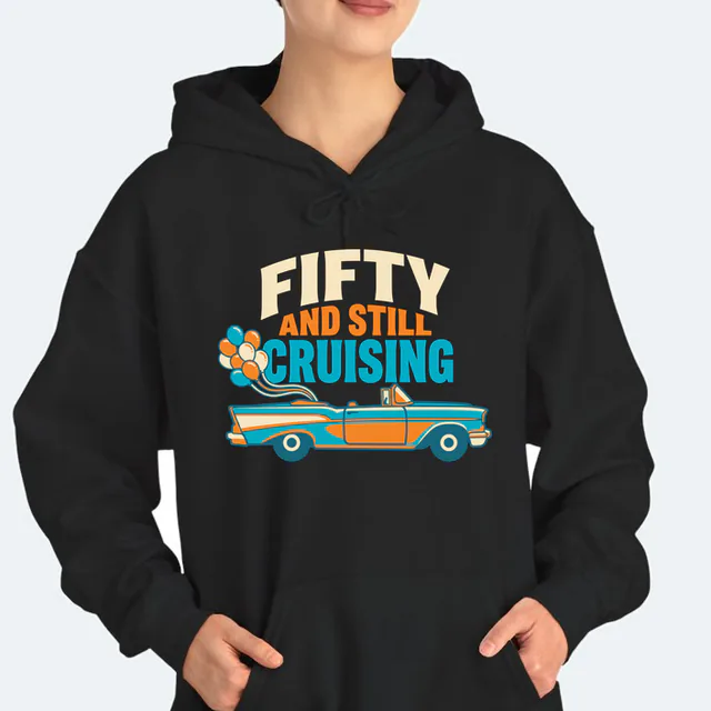 A convertible trailing balloons, FIFTY AND STILL CRUISING, on a black adult hoodie