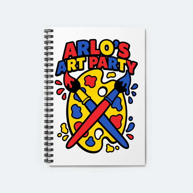 A paint palette with crossed brushes, ARLO'S ART PARTY, on a white spiral notebook