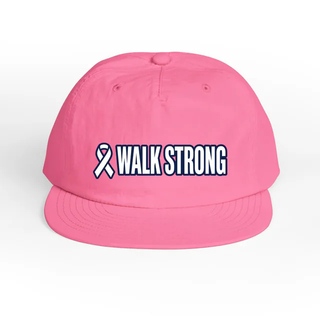 An awareness ribbon beside WALK STRONG, on a charity pink surf cap