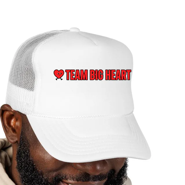 A heart on walking legs beside TEAM BIG HEART, on a white foam trucker hat