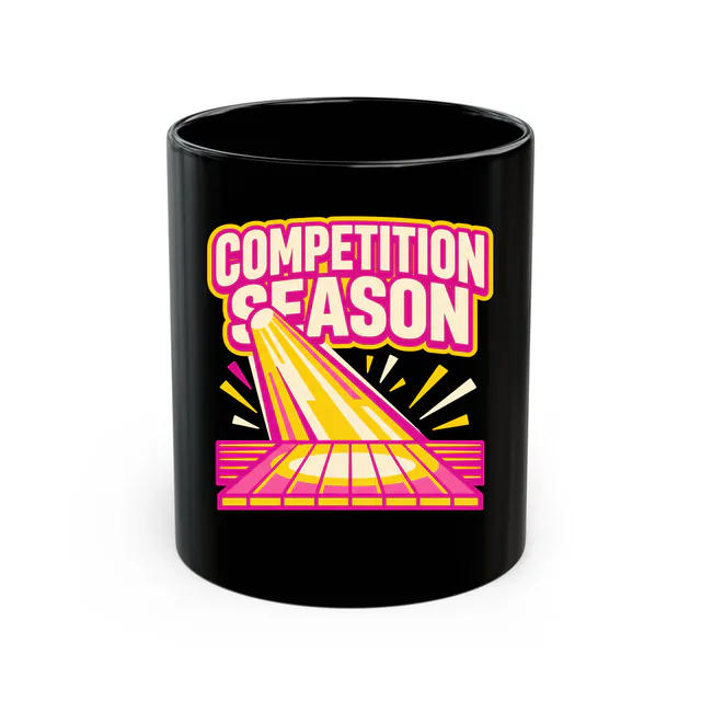 A spotlight pouring onto an empty stage, COMPETITION SEASON, on a black mug