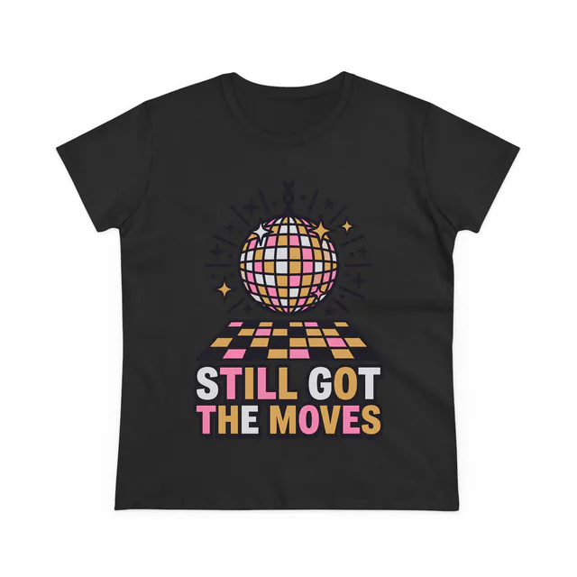 A disco ball over the dance floor, STILL GOT THE MOVES, on a black women's t-shirt