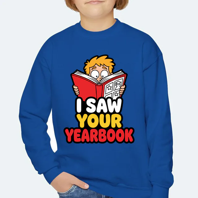 A wide-eyed kid behind a yearbook, I SAW YOUR YEARBOOK, on a royal youth crewneck