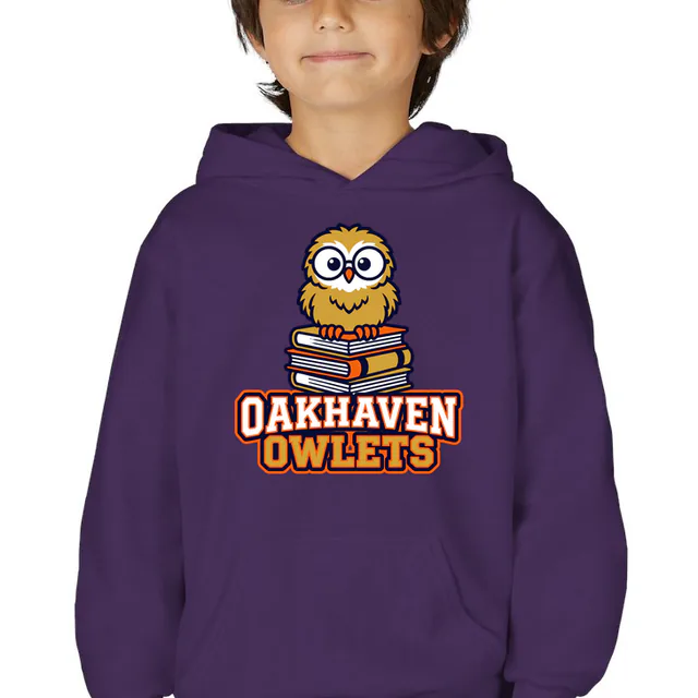 An owl chick in big glasses for the Oakhaven Owlets, on a purple youth hoodie
