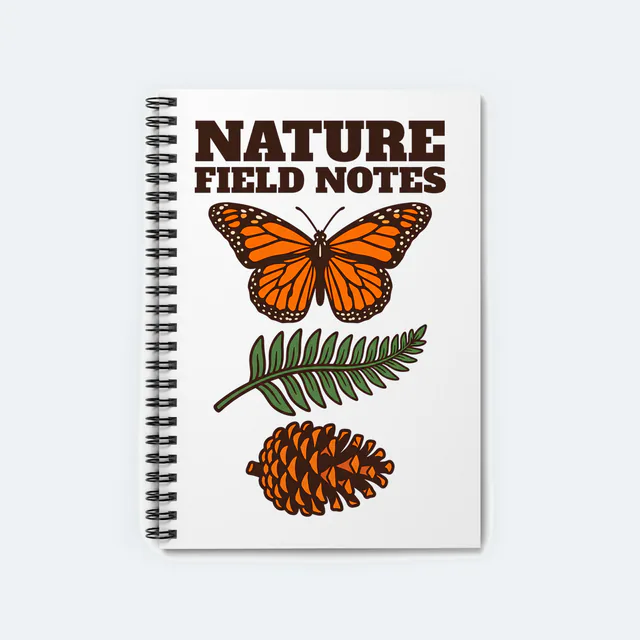 A monarch, a fern and a pinecone, NATURE FIELD NOTES, on a white spiral notebook