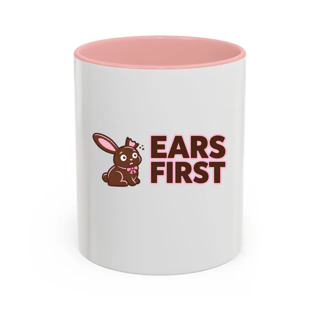 A chocolate bunny missing an ear, EARS FIRST, on a pink accent mug