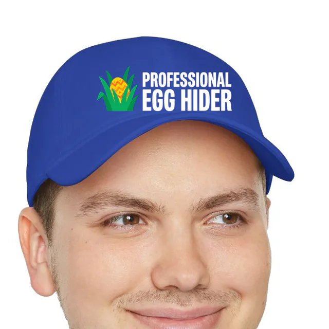 An egg peeking from the grass, PROFESSIONAL EGG HIDER, on a royal dad hat