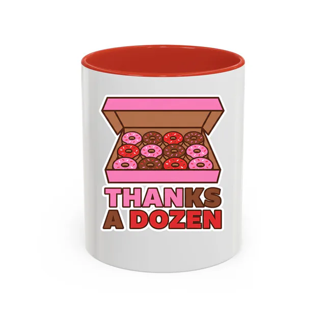 An open box of sprinkled donuts, THANKS A DOZEN, on a red accent mug