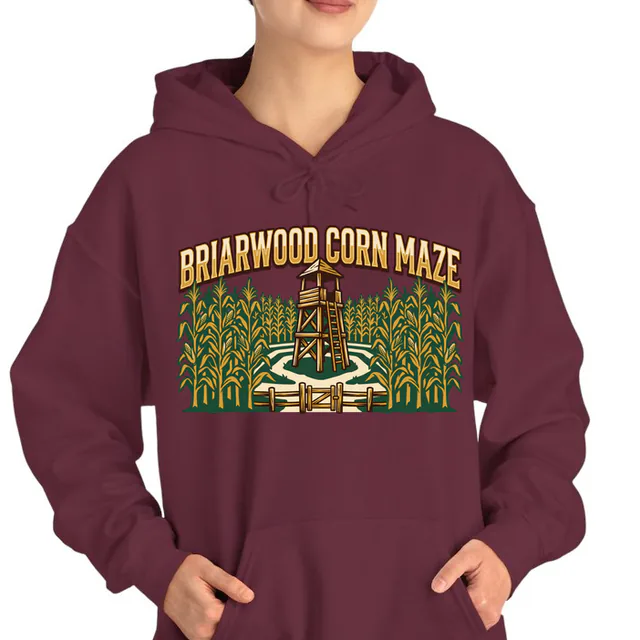 A corn maze with a lookout tower, BRIARWOOD CORN MAZE, on a maroon adult hoodie