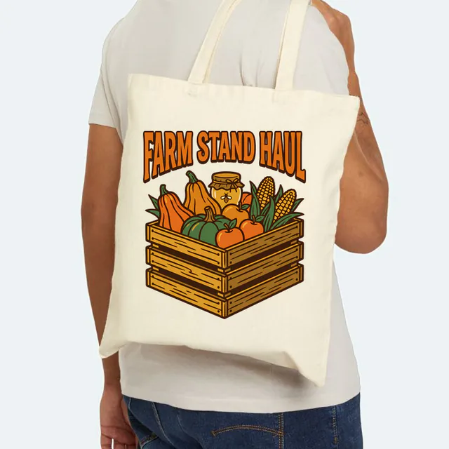 A crate of squash, corn and honey, FARM STAND HAUL, on a natural canvas tote