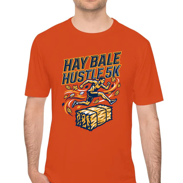 A runner leaping a hay bale for the Hay Bale Hustle 5K, on an orange performance tee