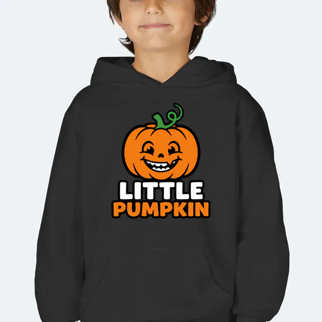 A grinning pumpkin with a vine cowlick, LITTLE PUMPKIN, on a black youth hoodie