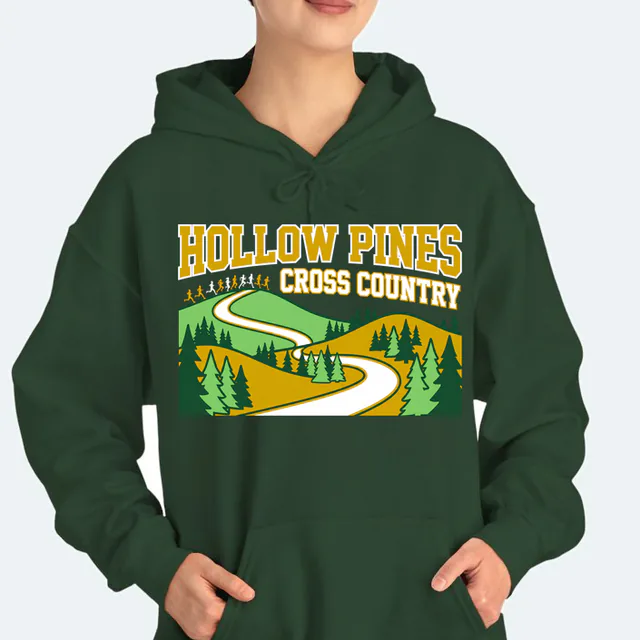 Runners cresting a pine ridge for Hollow Pines cross country, on a forest green adult hoodie