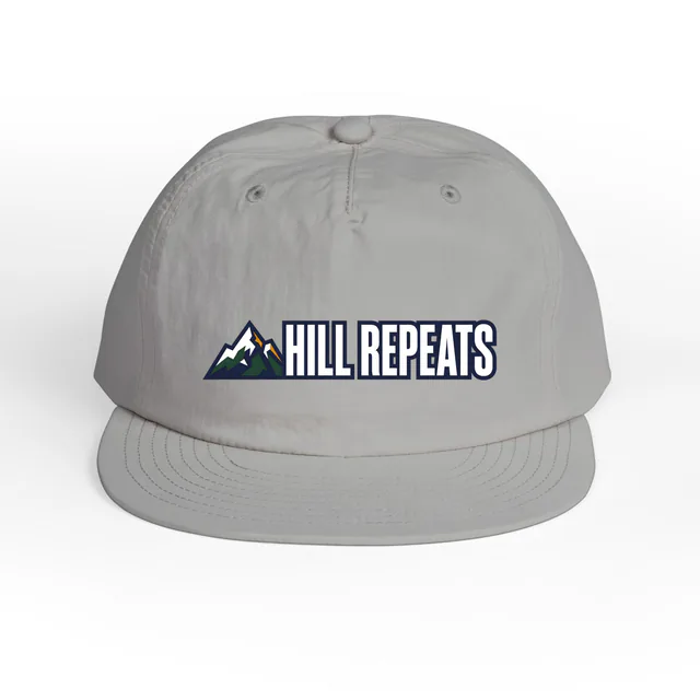 A small mountain peak beside HILL REPEATS, on a storm surf cap