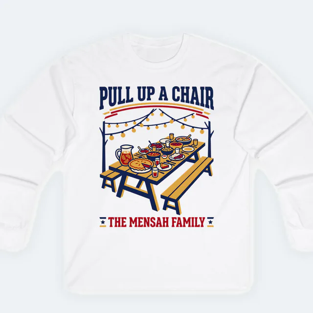 A picnic table under string lights, PULL UP A CHAIR, on a white adult long sleeve