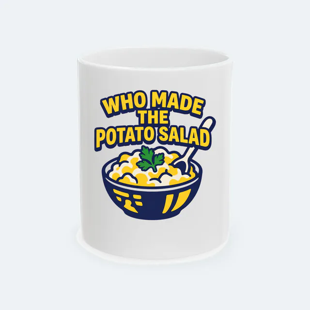 A bowl of potato salad, WHO MADE THE POTATO SALAD, on a white ceramic mug