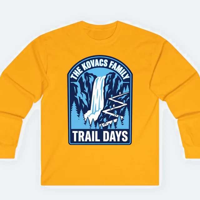 A waterfall and tiny hikers for the Kovacs family, TRAIL DAYS, on a gold adult long sleeve