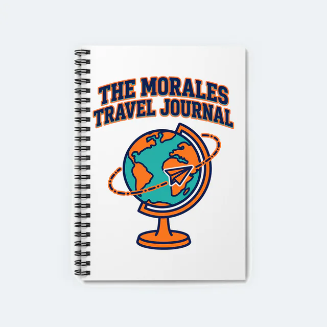 A globe circled by a paper airplane, the Morales travel journal, on a white spiral notebook