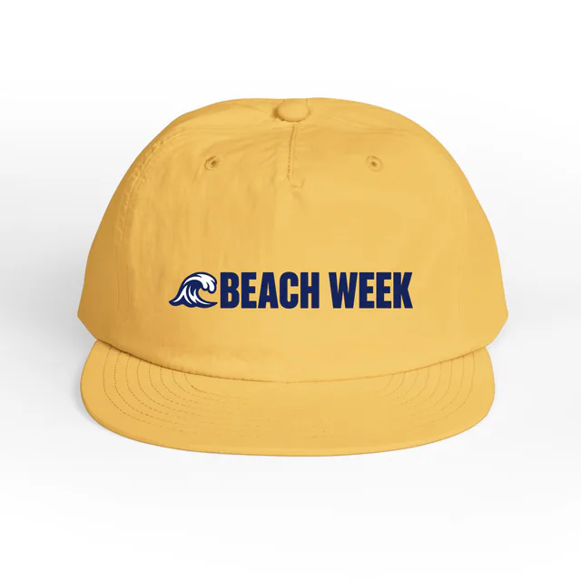 A curling wave beside BEACH WEEK, on a sunset surf cap