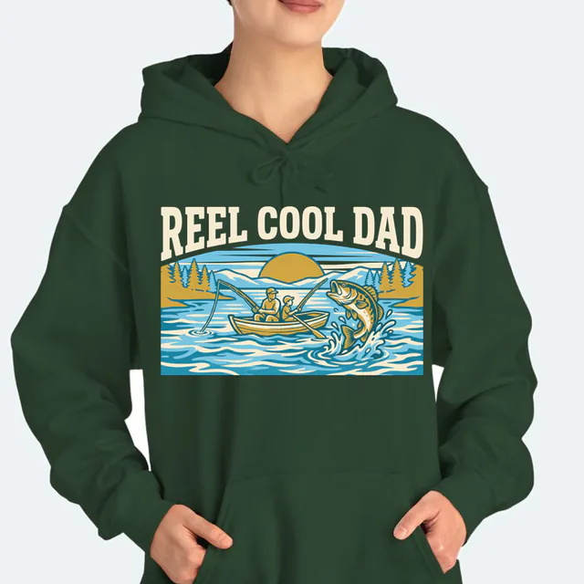 A dad and kid fishing as a big one jumps, REEL COOL DAD, on a forest green adult hoodie