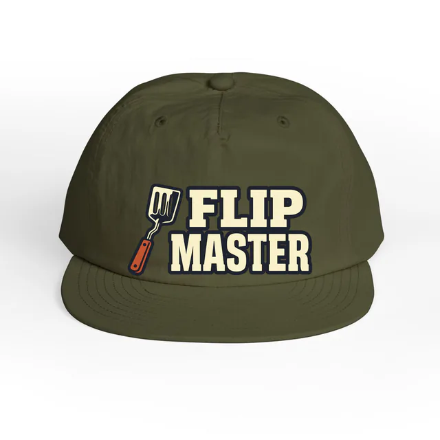 A grill spatula beside FLIP MASTER, on an army surf cap