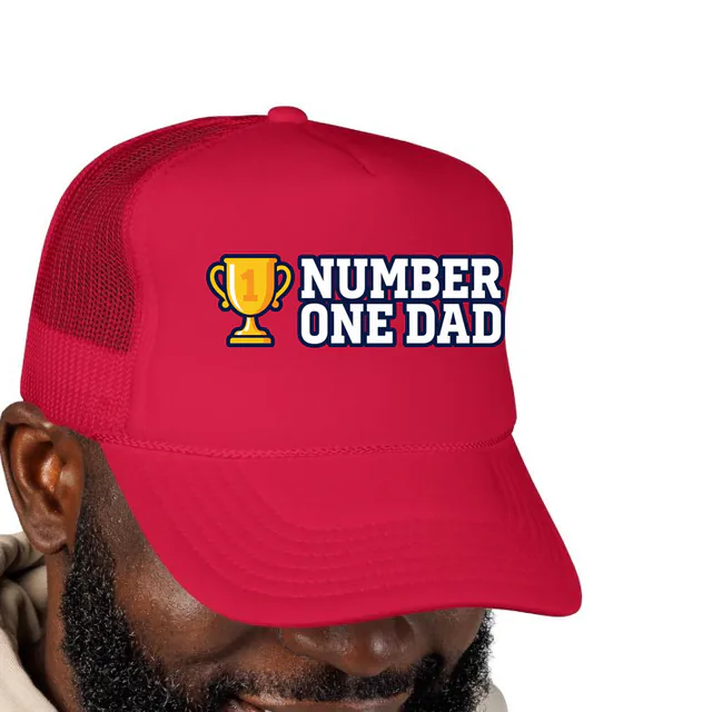 A gold trophy beside NUMBER ONE DAD, on a red foam trucker hat