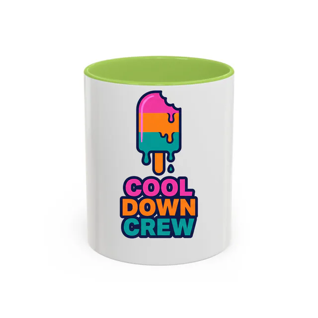 A dripping rainbow ice pop, COOL DOWN CREW, on a light green accent mug
