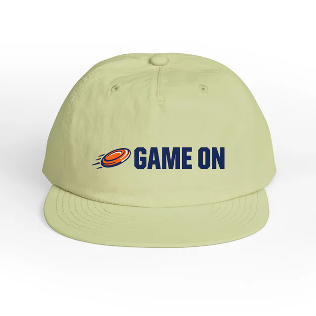 A flying disc beside GAME ON, on a lime surf cap