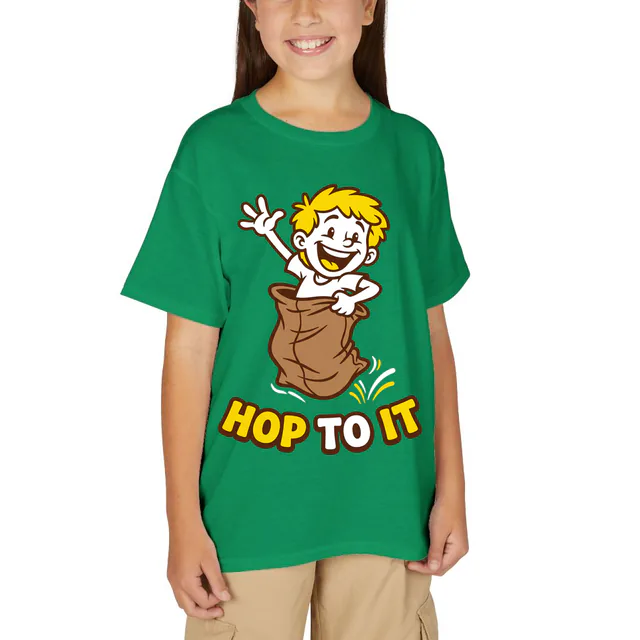 A kid hopping in a sack race, HOP TO IT, on a kelly green youth t-shirt