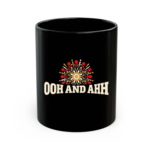 A starburst firework over OOH AND AHH, on a black mug