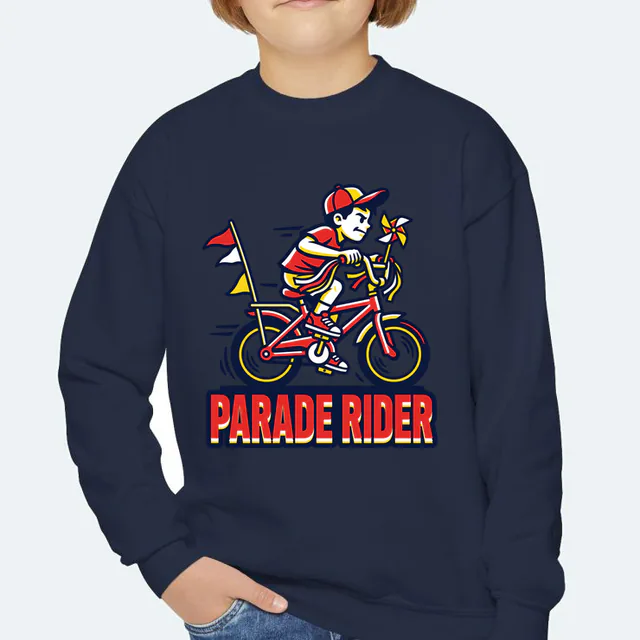 A kid on a streamer-covered bike, PARADE RIDER, on a navy youth crewneck