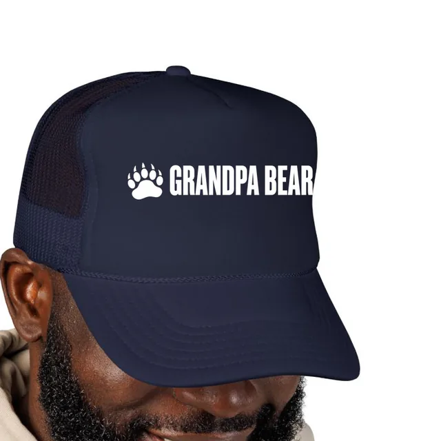 A bear paw beside GRANDPA BEAR, on a navy foam trucker hat