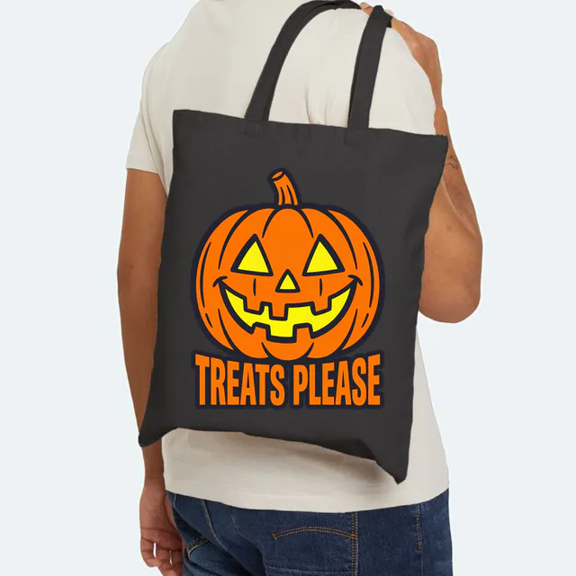 A jack-o'-lantern face over TREATS PLEASE, for trick-or-treat night, on a black canvas tote