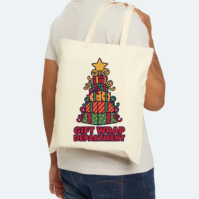 A tower of presents for the GIFT WRAP DEPARTMENT, on a natural canvas tote