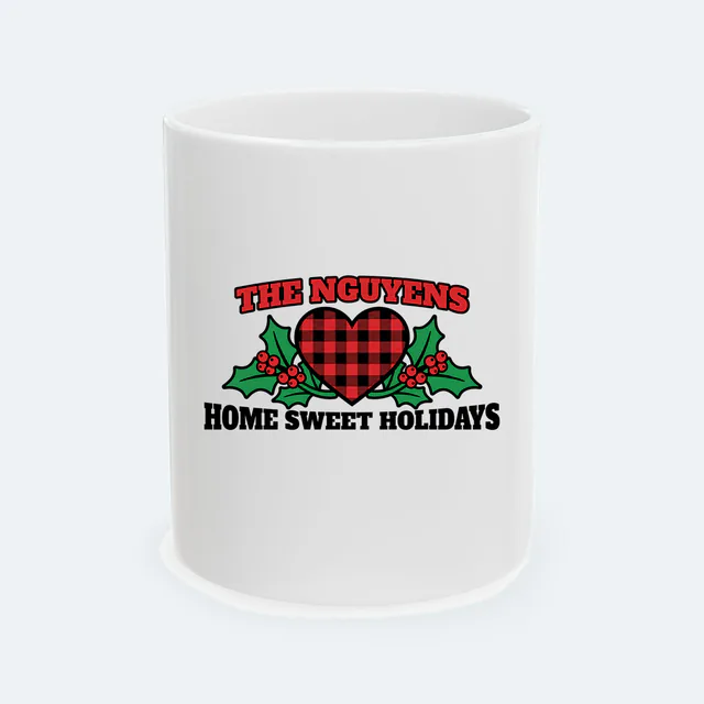 A buffalo-check heart for the Nguyens, HOME SWEET HOLIDAYS, on a white ceramic mug