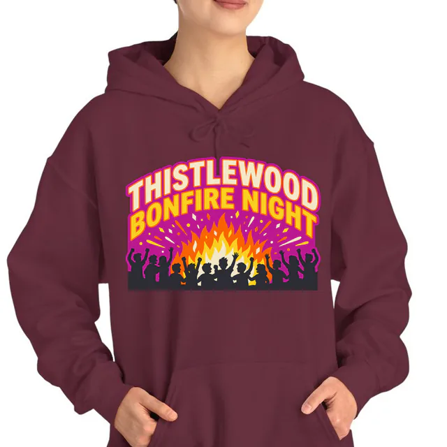 Students cheering around a roaring bonfire, THISTLEWOOD BONFIRE NIGHT, on a maroon adult hoodie