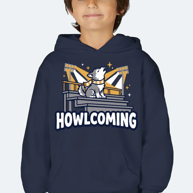 A wolf pup howling from the top row, HOWLCOMING, on a navy youth hoodie