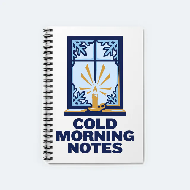 A frosted window with ice crystals, COLD MORNING NOTES, on a white spiral notebook