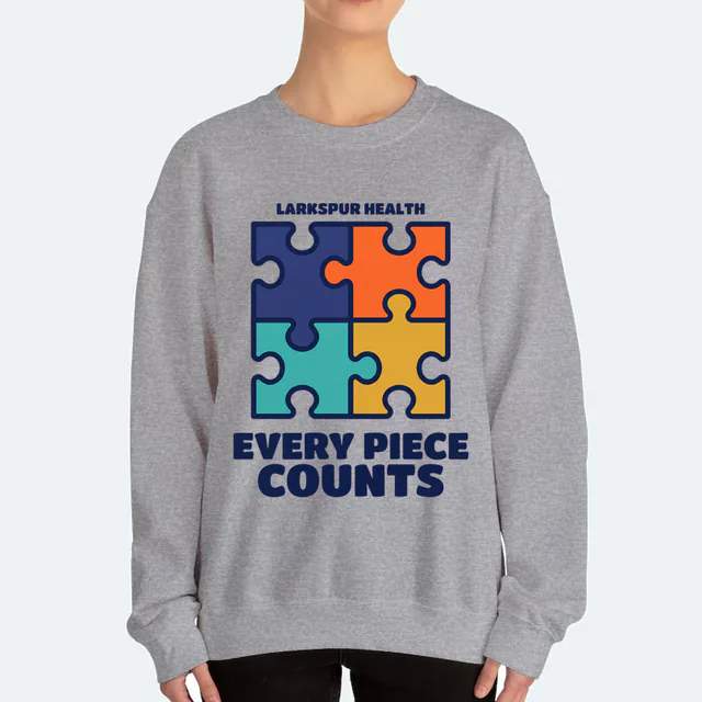 Four puzzle pieces clicking together, EVERY PIECE COUNTS, on a sport gray adult crewneck