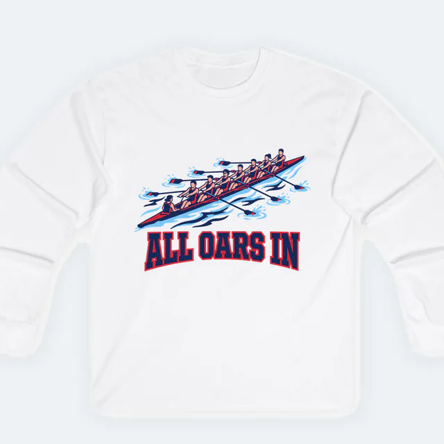 A rowing crew pulling in unison, ALL OARS IN, on a white adult long sleeve